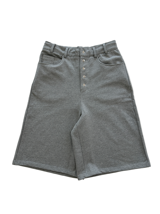 Gray shorts with button details on a white background