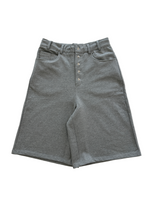 Gray shorts with button details on a white background